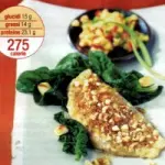 Ricetta filetti di pesce nasello con noci o mandorle tritate e contorno di frutta e verdura (275 calorie)