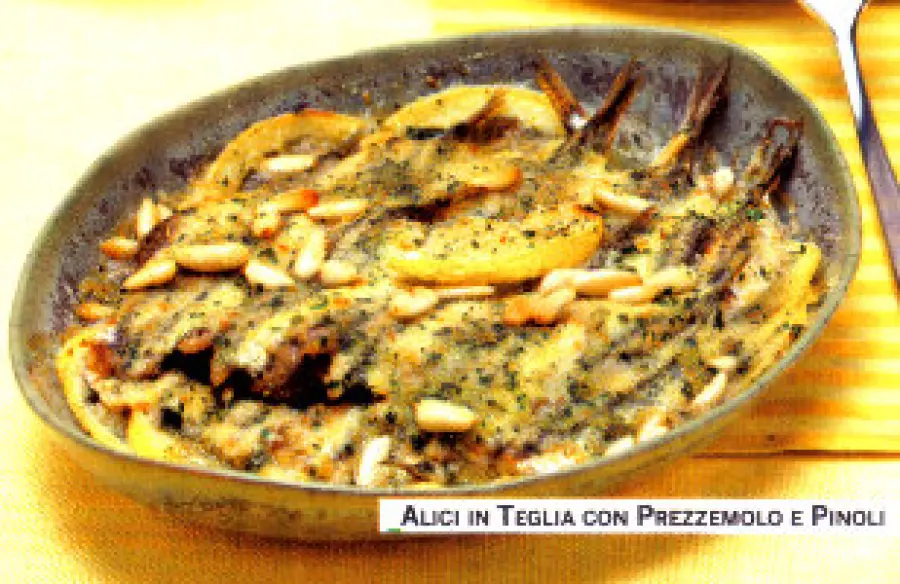 Ricetta alici (o acciughe) al forno con pinoli, olive, prezzemolo, pangrattato: secondo piatto dietetico pesce