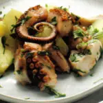 Ricette dietetiche pesce: ricetta Polpo con Patate. Secondo piatto di pesce da 310 kcalorie a porzione